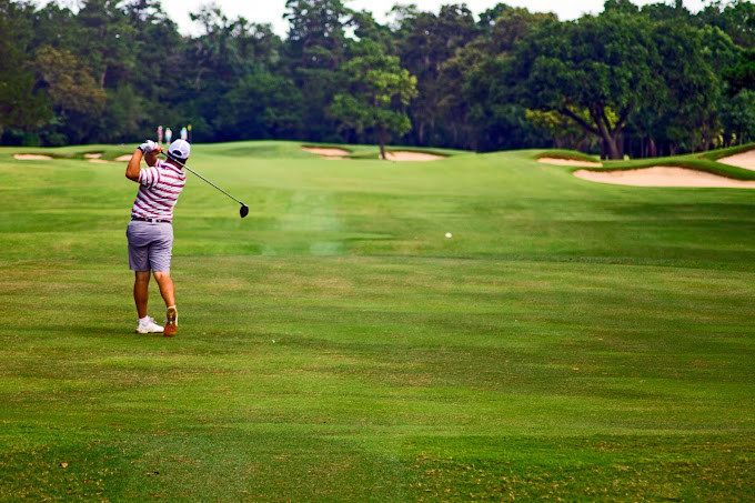 person golfing